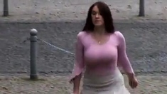 Busty girl walking, no bra, jiggling