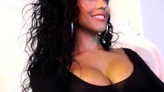 Busty babe playing with her big boobs