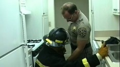 Nasty fire-fighter shoves his dirty cock in the mouth of police officer