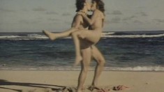 A couple of lusty lovers have a great time banging on the beach